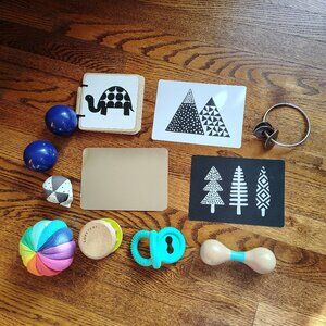 Lovevery first year toys bundle including rattle, balls, cars and teether